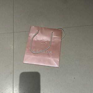 Pearly pink Escada small paper bag.